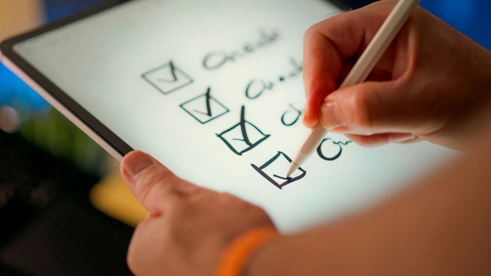 A checklist being ticked off on a tablet