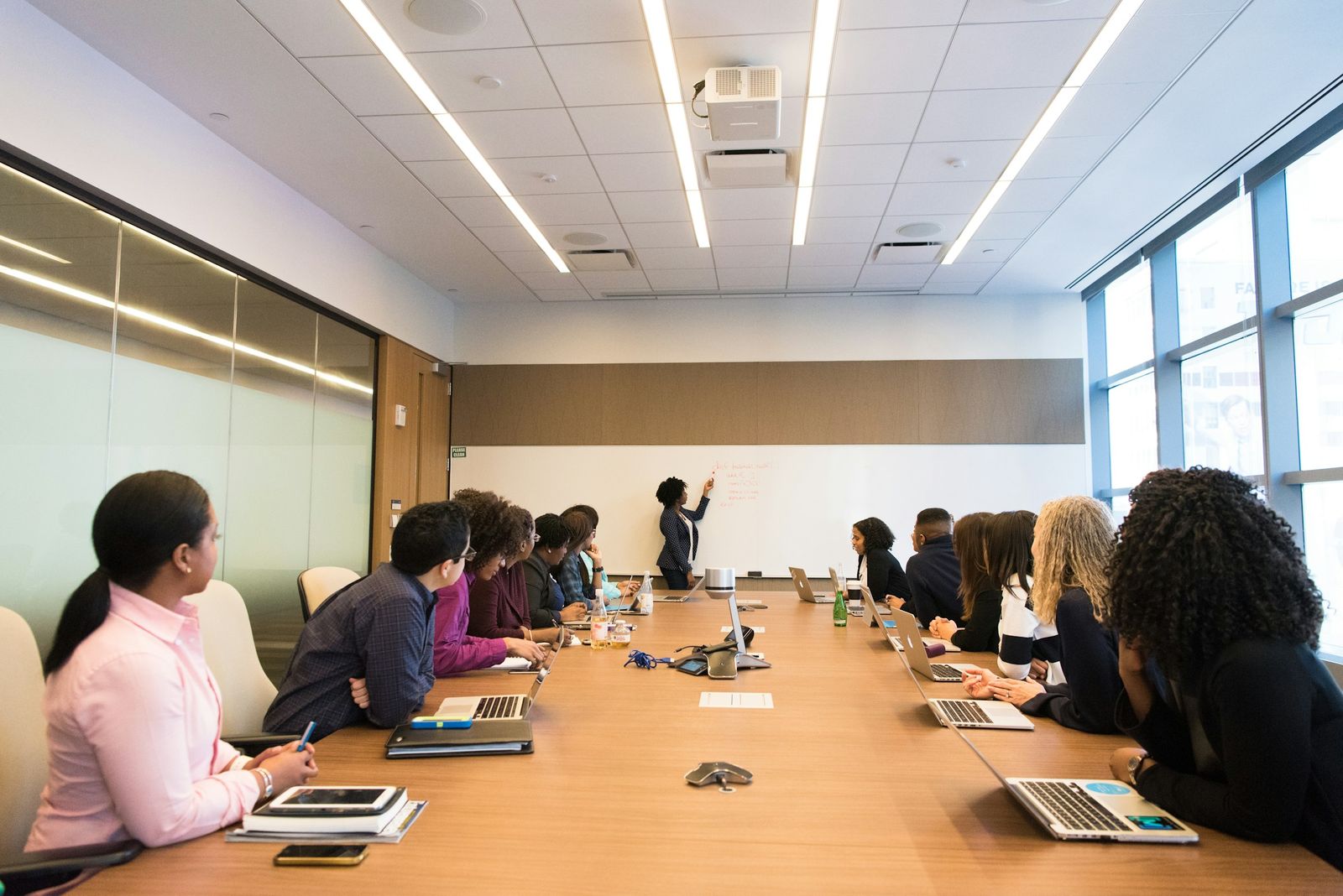 A team meeting with one person speaking to the room